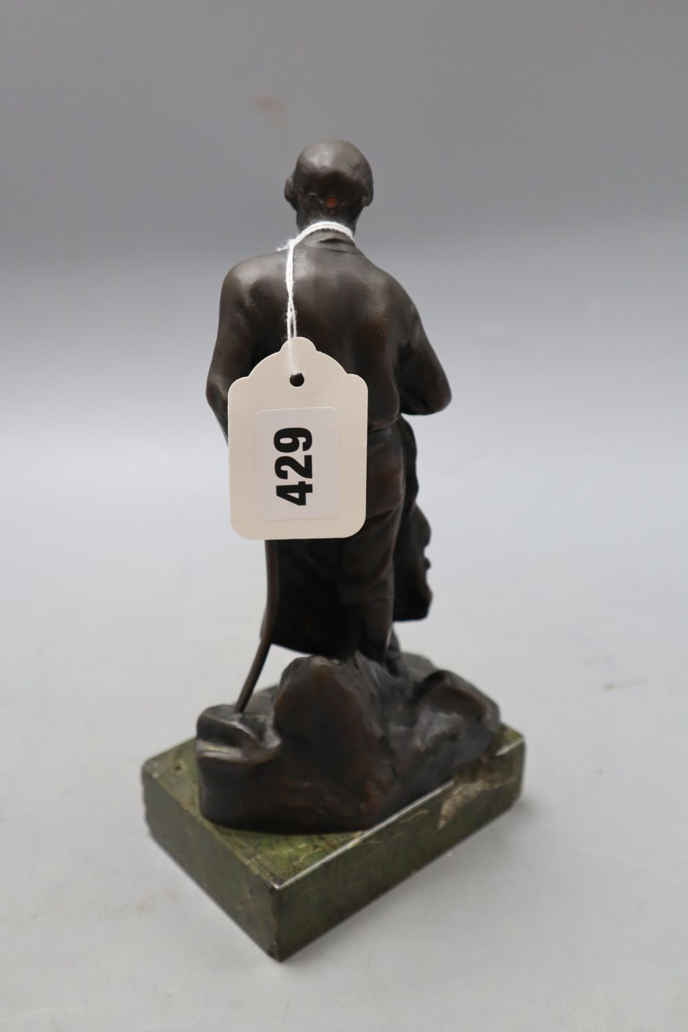 A bronze of a blacksmith, signed, height 22.5cm